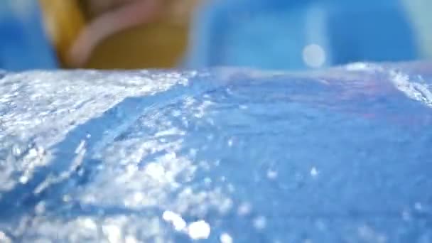 Water flows out of pipe in water park. water slides in amusement park. slow motion — Stock Video