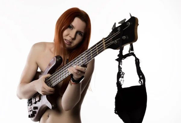 Sexy nude rock woman playing on electric guitar on a white background. — Stock Photo, Image