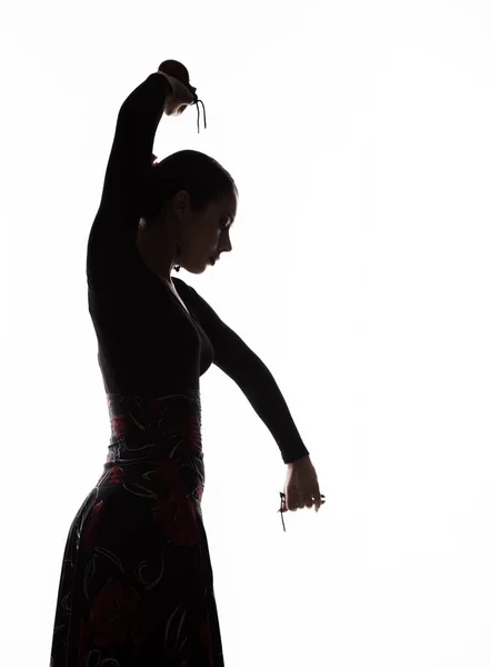 Silhouette di ragazza spagnola ballerina di flamenco su uno sfondo leggero — Foto Stock