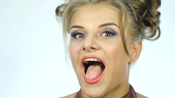 Funny beautiful woman show tongue and smiles. Slow motion — Stock Video