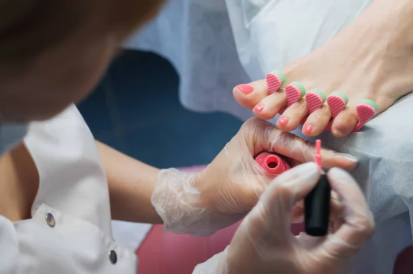 Profesional nail technician sanding nails with machine — Stock Photo, Image