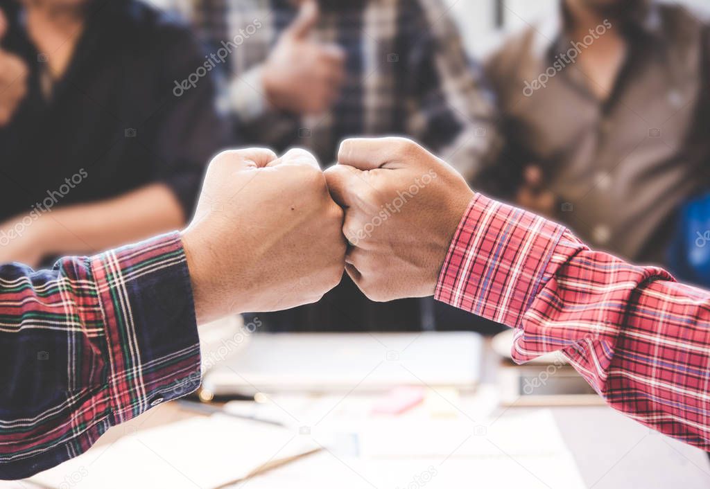 Businessman and engineer working hands of business people join hand together. Teamwork Concept.