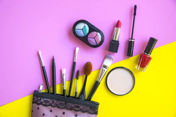 Cosmetics and fashion background with make up artist objects: lipstick, eye shadows, mascara ,eyeliner, concealer, nail polish.  Lifestyle Concept — Stock Photo, Image