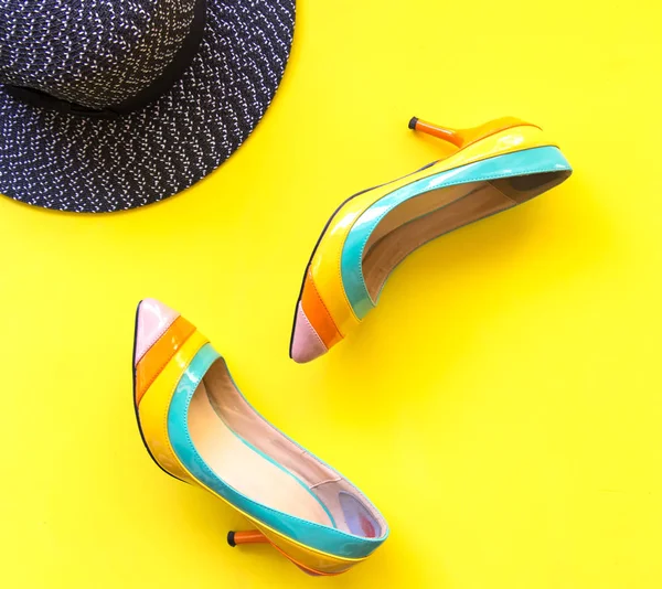 Fashion woman accessories set. Trendy fashion shoes heels, stylish handbag clutch. Colorfull background.  Lifestyle Concept.