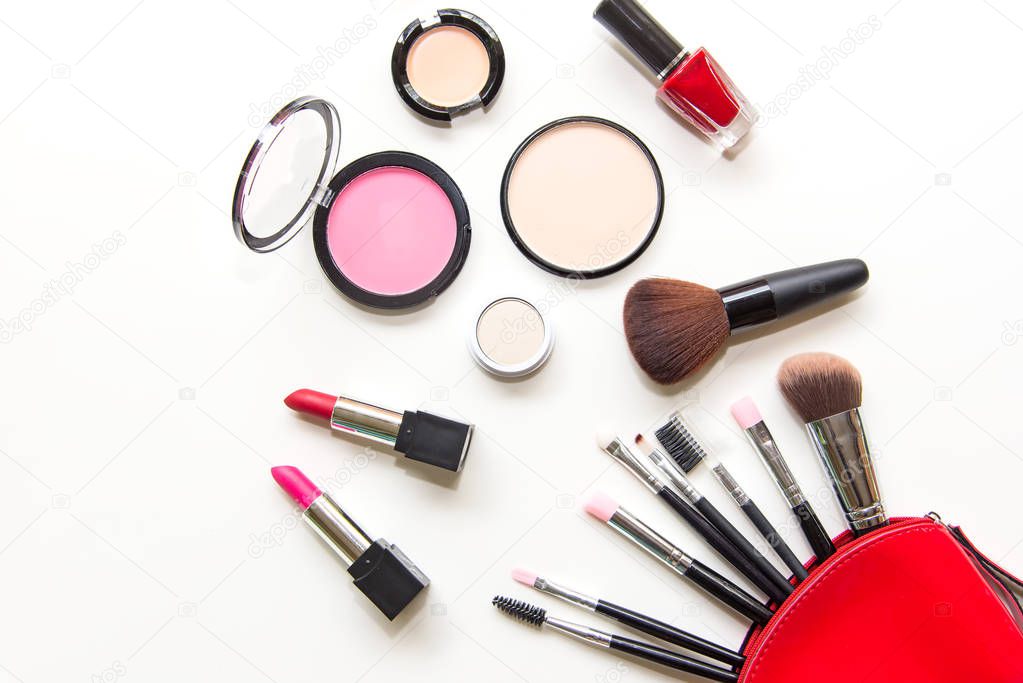 Makeup cosmetics tools background and beauty cosmetics, products and facial cosmetics package lipstick, eyeshadow on the white background.