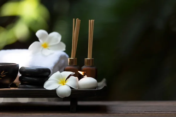 Thai spa composition treatments aroma therapy with candles and Plumeria flowers. Healthy and Relax Concep