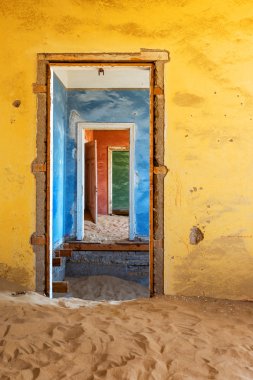 Abandoned building with sand in Namib desert clipart