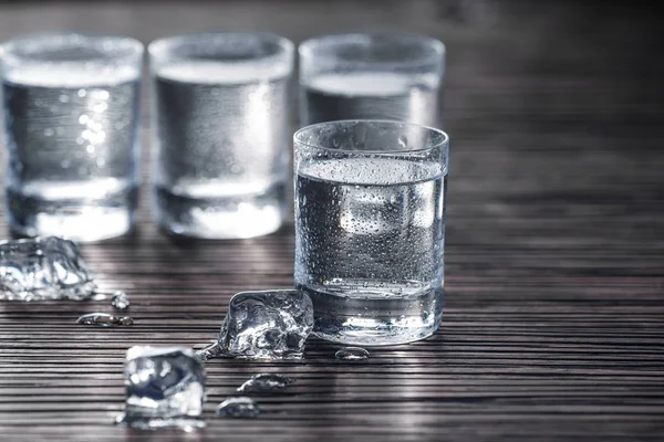 Drops on shot with vodka — Stock Photo, Image