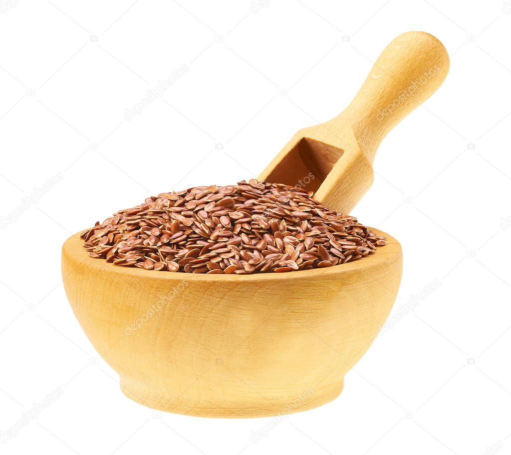 Linseed or  flaxseed in a wooden bowl with a spoon isolated on a white background.