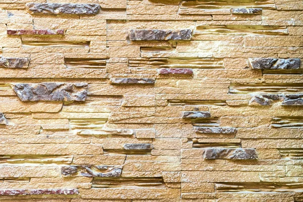 Стена из декоративного коричневого камня. Фон — стоковое фото