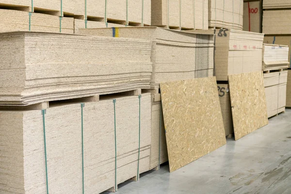 Warehouse of fiberboard and chipboard. Construction Materials. Wooden warehouse — Stock Image Warehouse of fiberboard and chipboard. Construction Materials. Wooden warehouse Royalty Free Stock Photos
