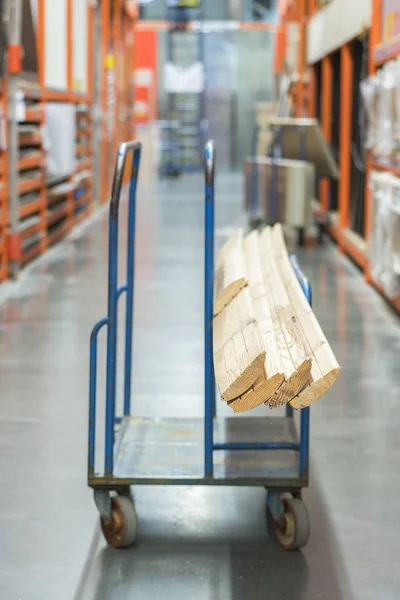 construction cart in the building store. Carts loaded with boards.