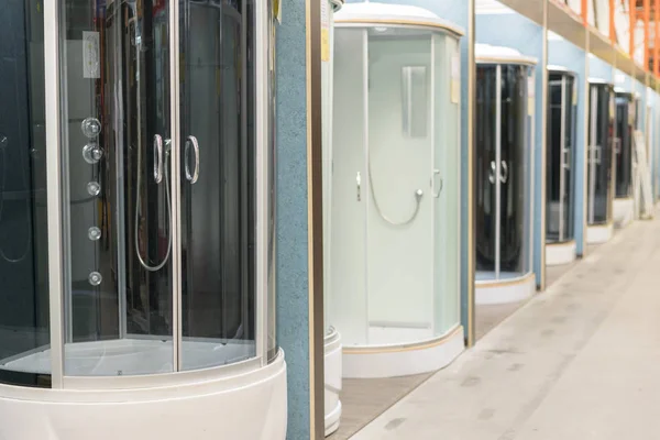 Shower cabins in the sanitary ware shop. inside HomePro store. The store provide advice and facilities for installation and maintenance of a wide range of domestic features