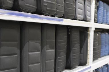 Black suitcases on shelf in store. Travel concept.