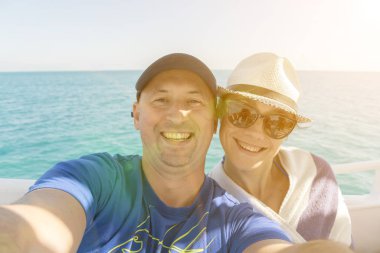 Couple doing selfie. Sea vacation concept.
