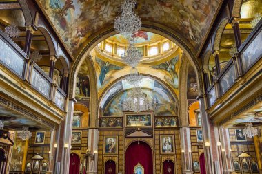 Sharm El Sheikh, Egypt - November 21, 2019: Christian Coptic Church. The beautiful interior. Golden mosaic. Wall painting.