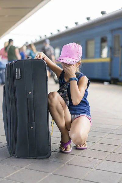 Kid crying to lost parent or live alone on sky train station. Little girl lost at the train station.