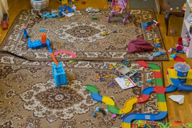 Games floor for preschoolers kindergarten. Mess in the room. Scattered toys. 