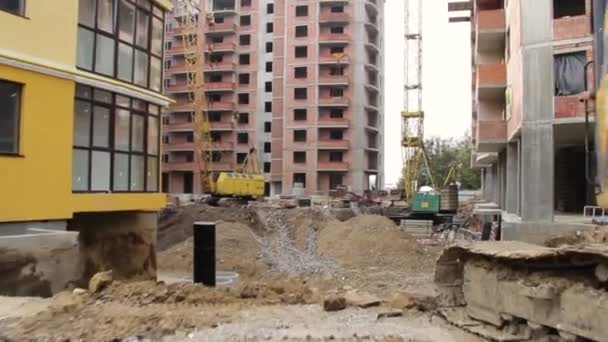 Construction site with cranes on sky background — Stock Video