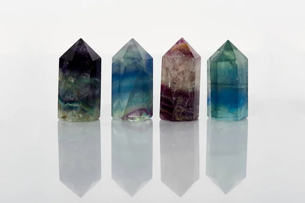 Four Faceted Natural Raw Mineral Crystal Fluorites Close Isolated White Royalty Free Stock Photos
