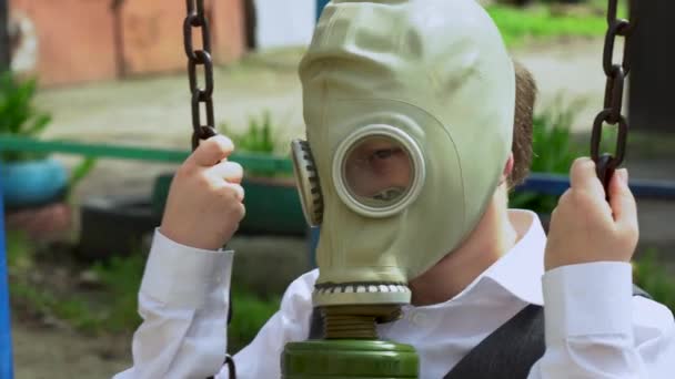 Caucasian Sad Little Boy Protective Green Gas Mask Head Riding — Stock Video