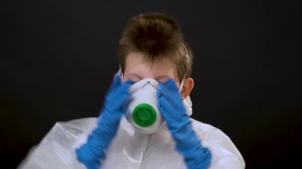 Handsome Little Boy White Protective Suit Blue Gloves Puts Glasses — Stock Video