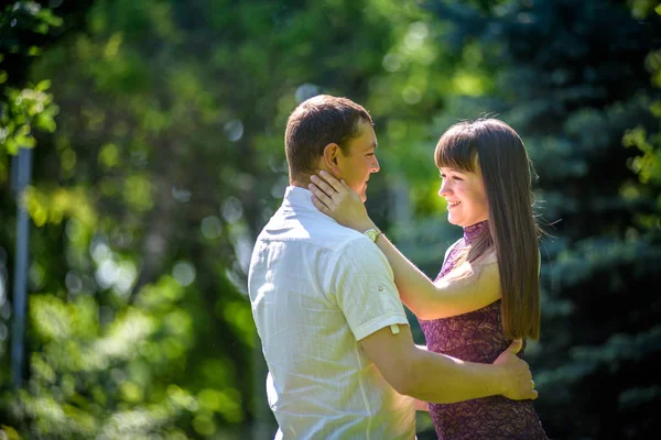 Loving young couple walk on the park at summer. — Stock Photo, Image