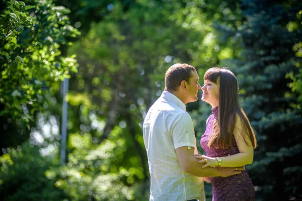 Loving young couple walk on the park at summer. — Stock Photo, Image