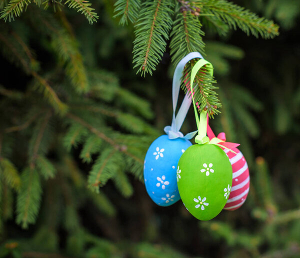 Colourful Easter eggs on Christmas tree