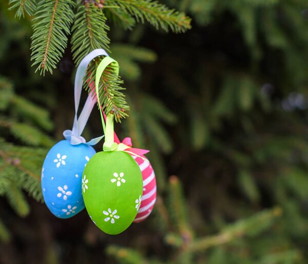 Colourful Easter eggs on Christmas tree