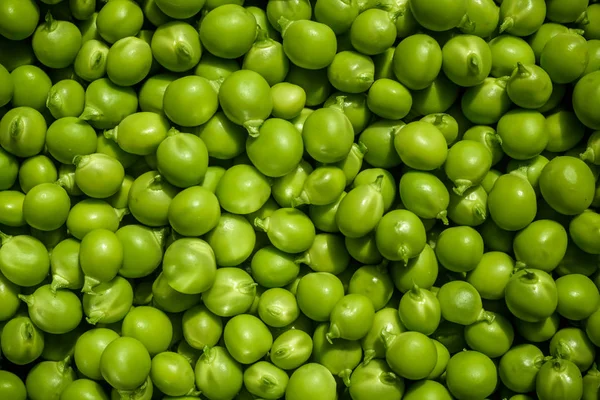 Gröna ärtor bakgrund textur vegetabiliskt. färsk bakgr — Stockfoto