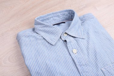 Casual shirt on wooden background