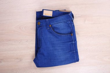 Blue jean on wooden background
