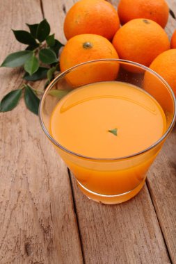 ripe mandarins on wood background, copy space 