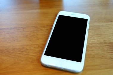 smartphone on desk in coffee cafe
