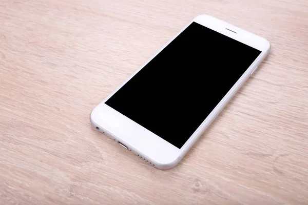 Blank screen smartphoneon wooden background