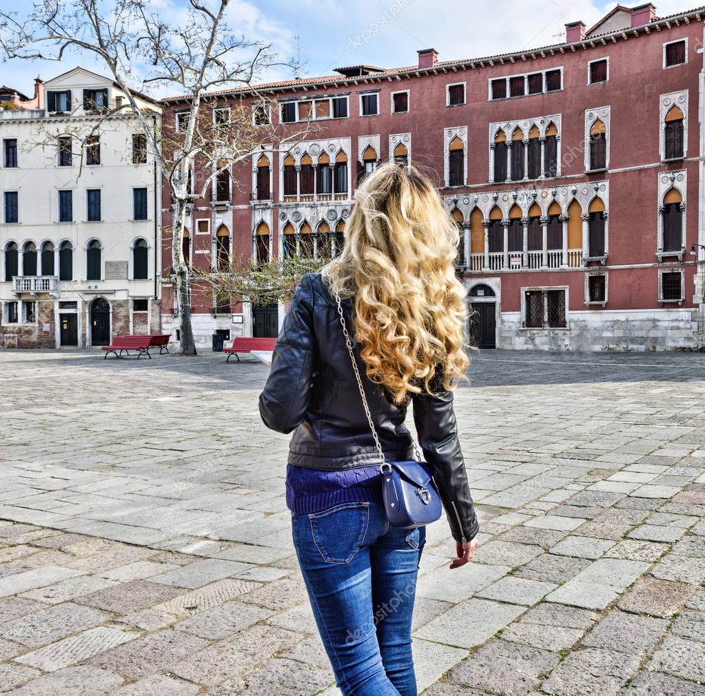 Woman walking in Venice Italy. Traveler or tourist girl exploring the ...
