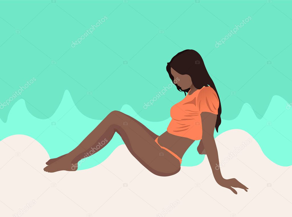 Tanned black girl relaxing on shore of the ocean at the beach. Blue water