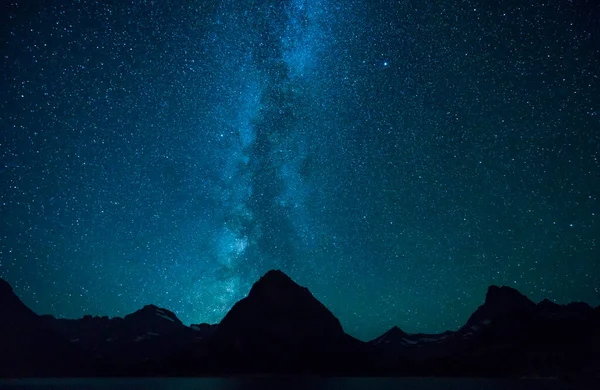 Swiftcurrent Lake  at night with star in Many Glacier area ,Montana's Glacier National Park,Montana,usa.
