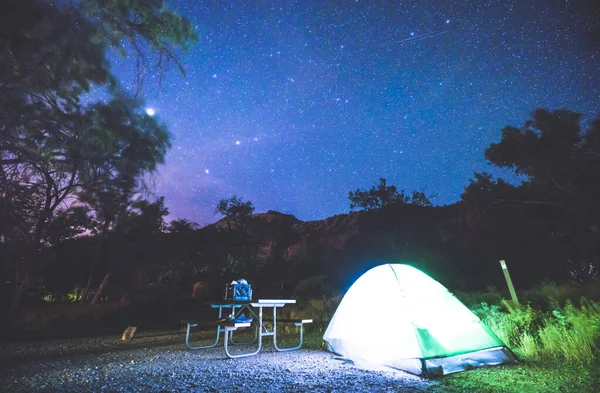 camping in campground area at night with star on the sky in national park campground.