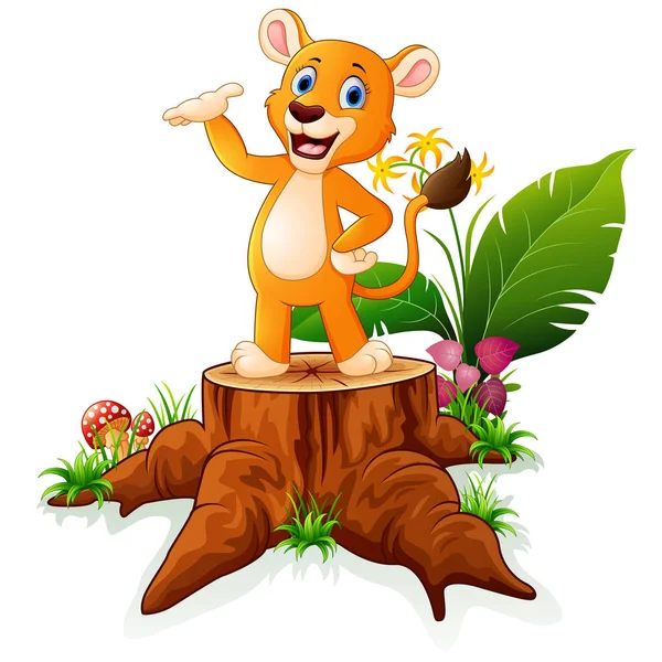 Caricatura bebé león presentando en árbol muñón — Vector de stock