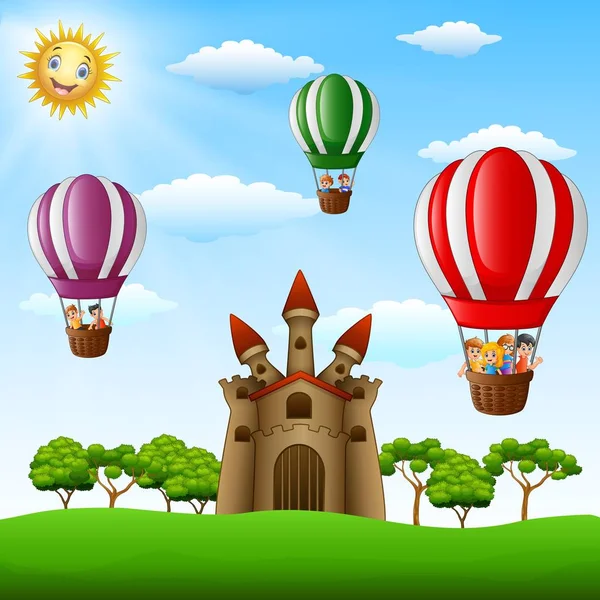 Desenhos animados crianças montando em um balão de ar quente perto do castelo —  Vetores de Stock