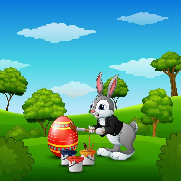 Pasqua coniglietto pittura uova di Pasqua nel parco — Vettoriale Stock