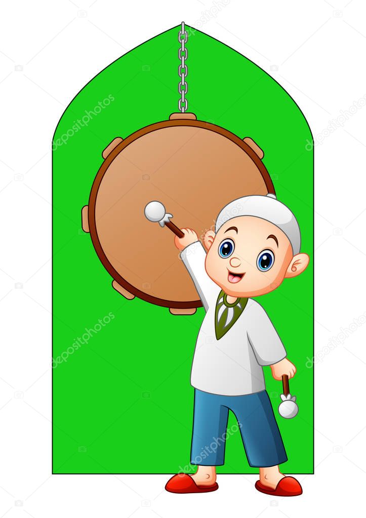 muslim kid holding stick standing in the front of mosque drum