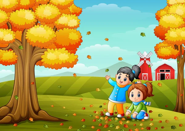 Счастливые дети играют с осенними листьями — стоковый вектор
