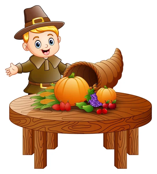 Pilgrim chlapce s hojnost ovoce a zeleniny na kulatý dřevěný stůl — Stockový vektor