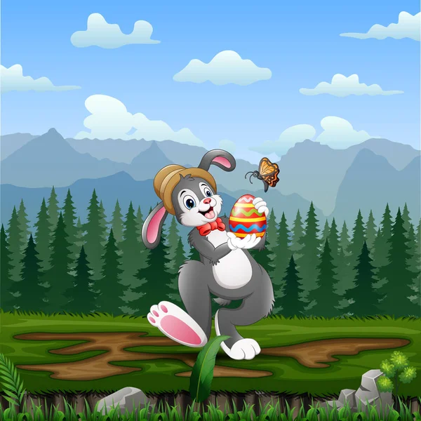 Mutlu Tavşan Kelebekli Paskalya Yumurtası Tutuyor — Stok Vektör