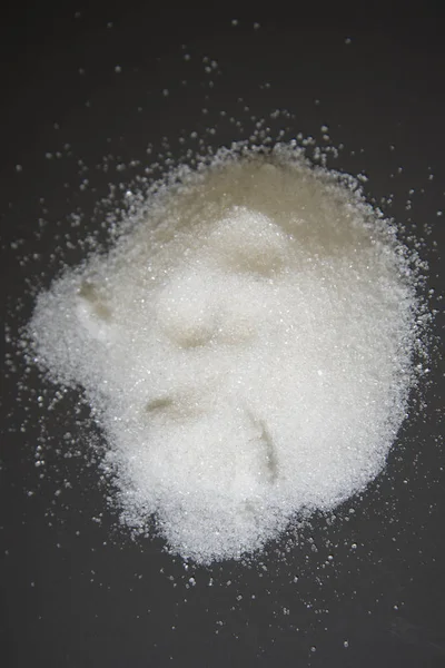 White sugar scattered on the table. — Stock Photo, Image