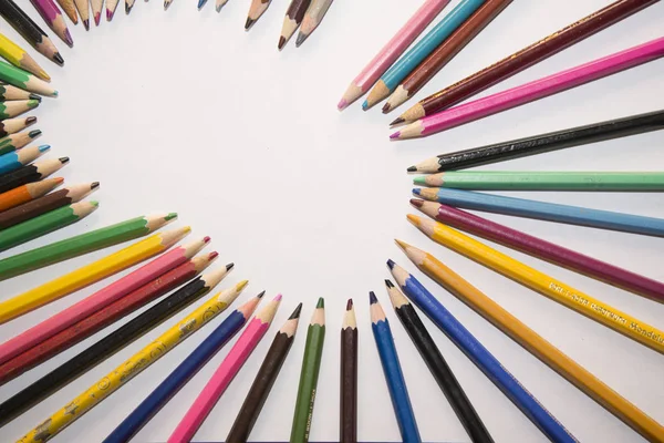 Lot of color pencils and a sheet of white paper. — Stock Photo, Image