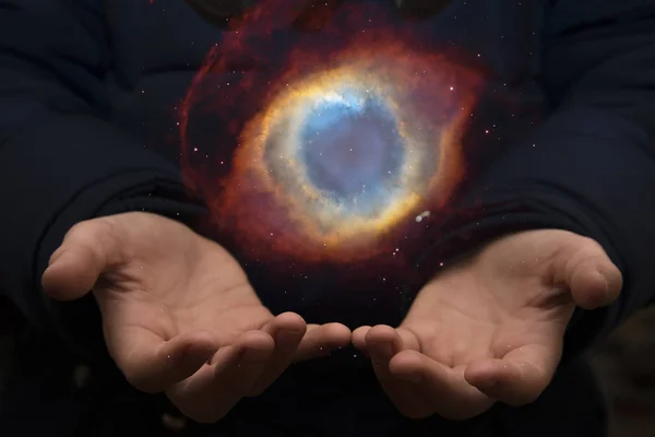 The vast universe in the hands of a child. Elements of this imag